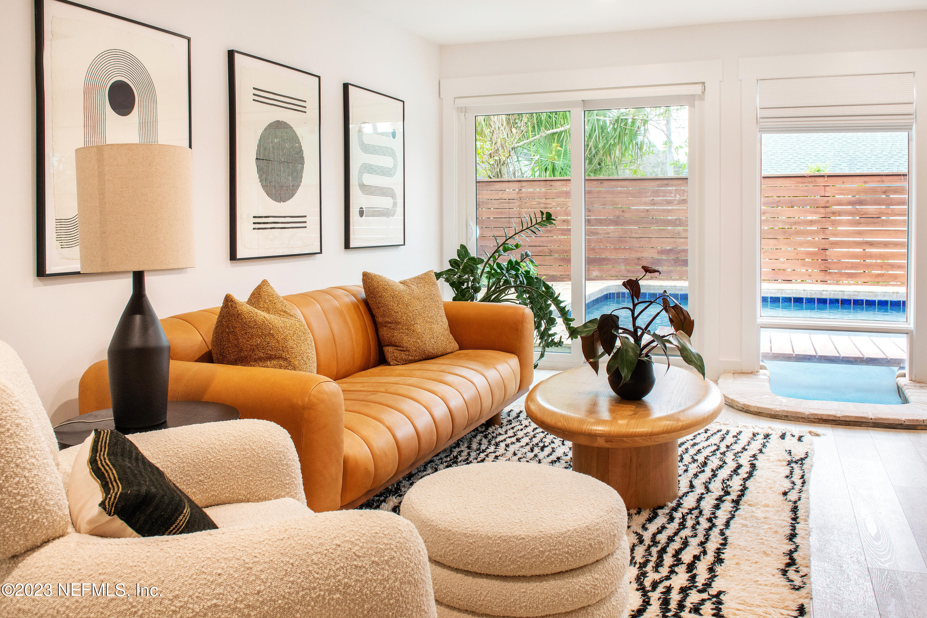 962 Ocean Boulevard Atlantic Beach, FL 32233 - Photo 32 of 63 a living room with furniture and a large window