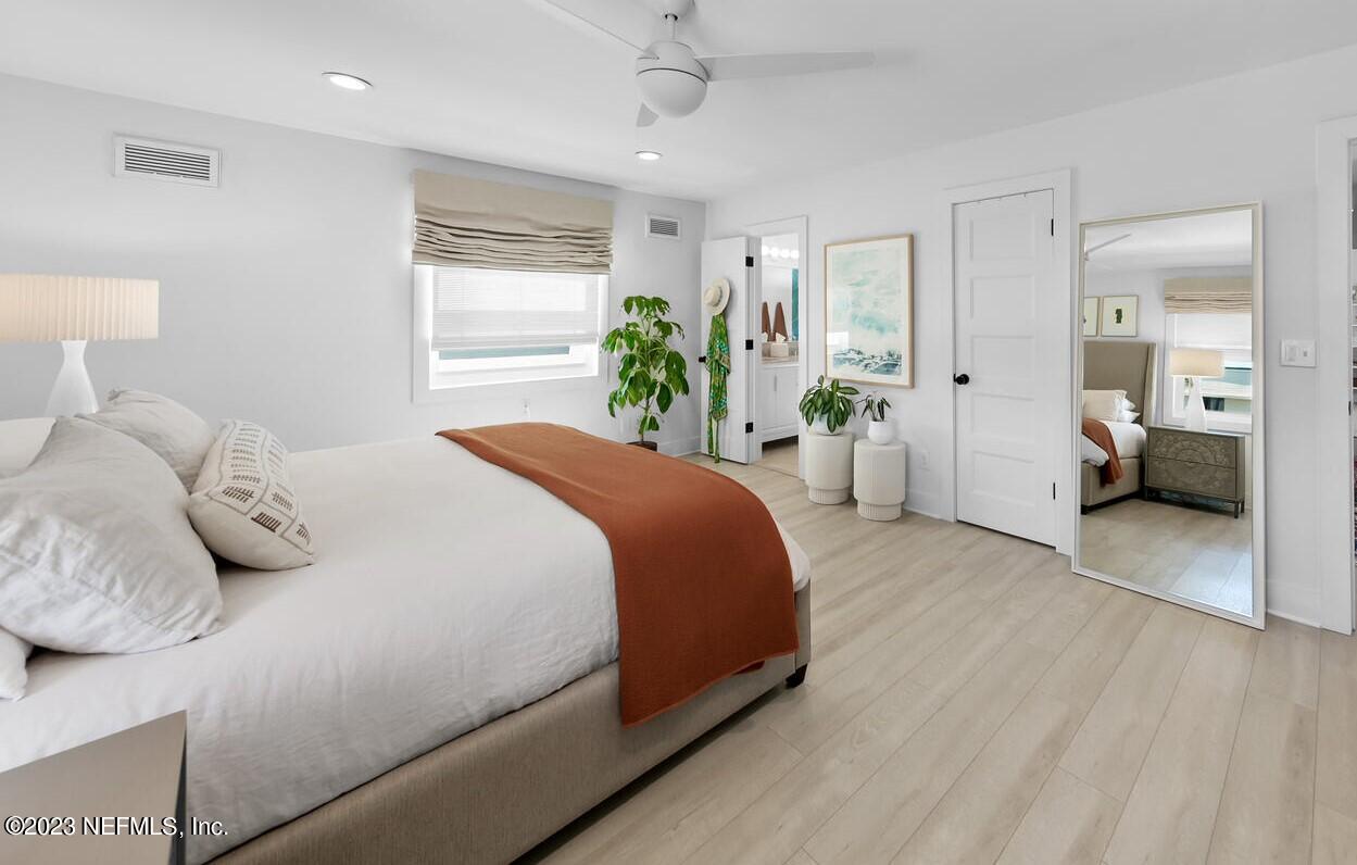 962 Ocean Boulevard Atlantic Beach, FL 32233 - Photo 35 of 63 a bedroom with a bed and a couch