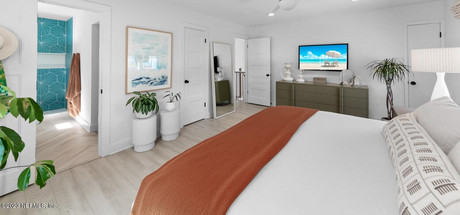 962 Ocean Boulevard Atlantic Beach, FL 32233 - Photo 36 of 63 a bedroom with a bed and a view of kitchen