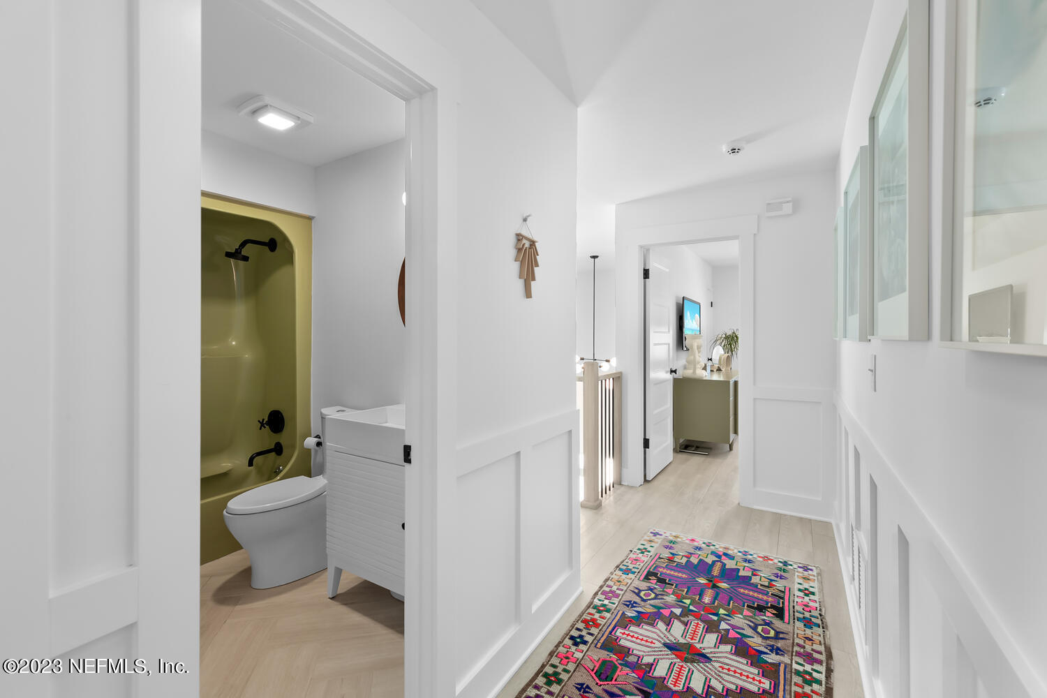 962 Ocean Boulevard Atlantic Beach, FL 32233 - Photo 40 of 63 a bathroom with a sink and mirror with toilet