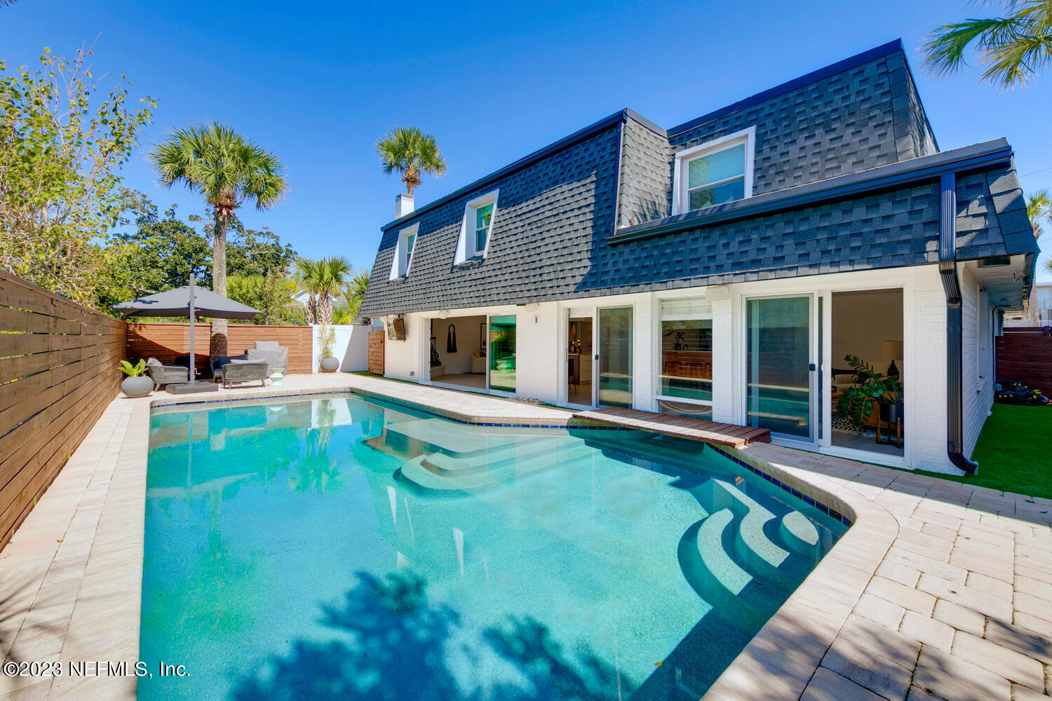 962 Ocean Boulevard Atlantic Beach, FL 32233 - Photo 50 of 63 a view of a house with pool