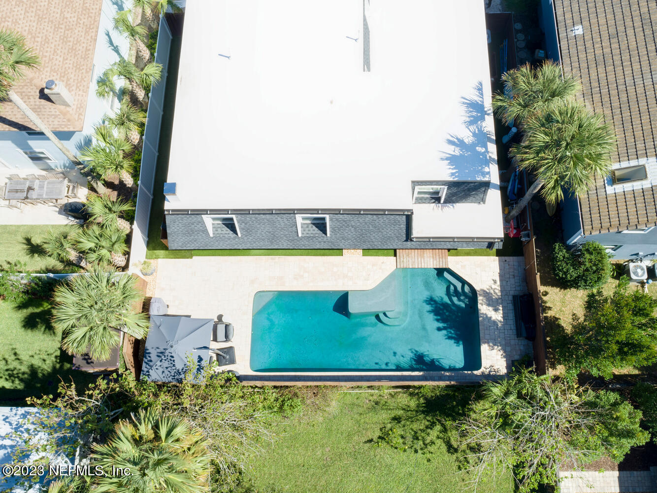 962 Ocean Boulevard Atlantic Beach, FL 32233 - Photo 5 of 63 an aerial view of a house with a yard