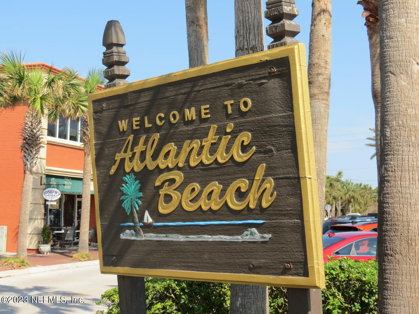 962 Ocean Boulevard Atlantic Beach, FL 32233 - Photo 52 of 63 a sign on the side of a building