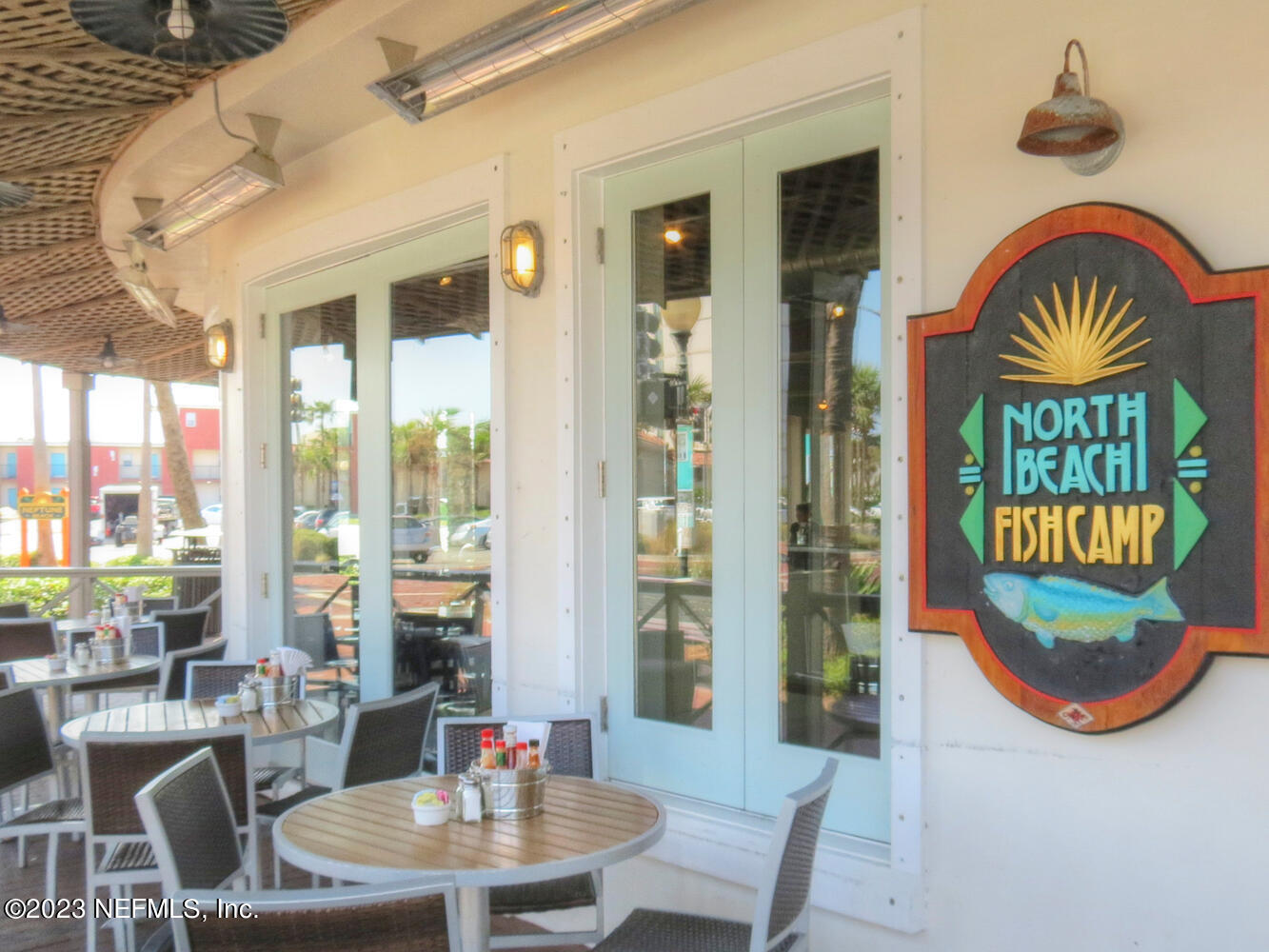 962 Ocean Boulevard Atlantic Beach, FL 32233 - Photo 58 of 63 a view of a dining room with furniture window and wooden floor