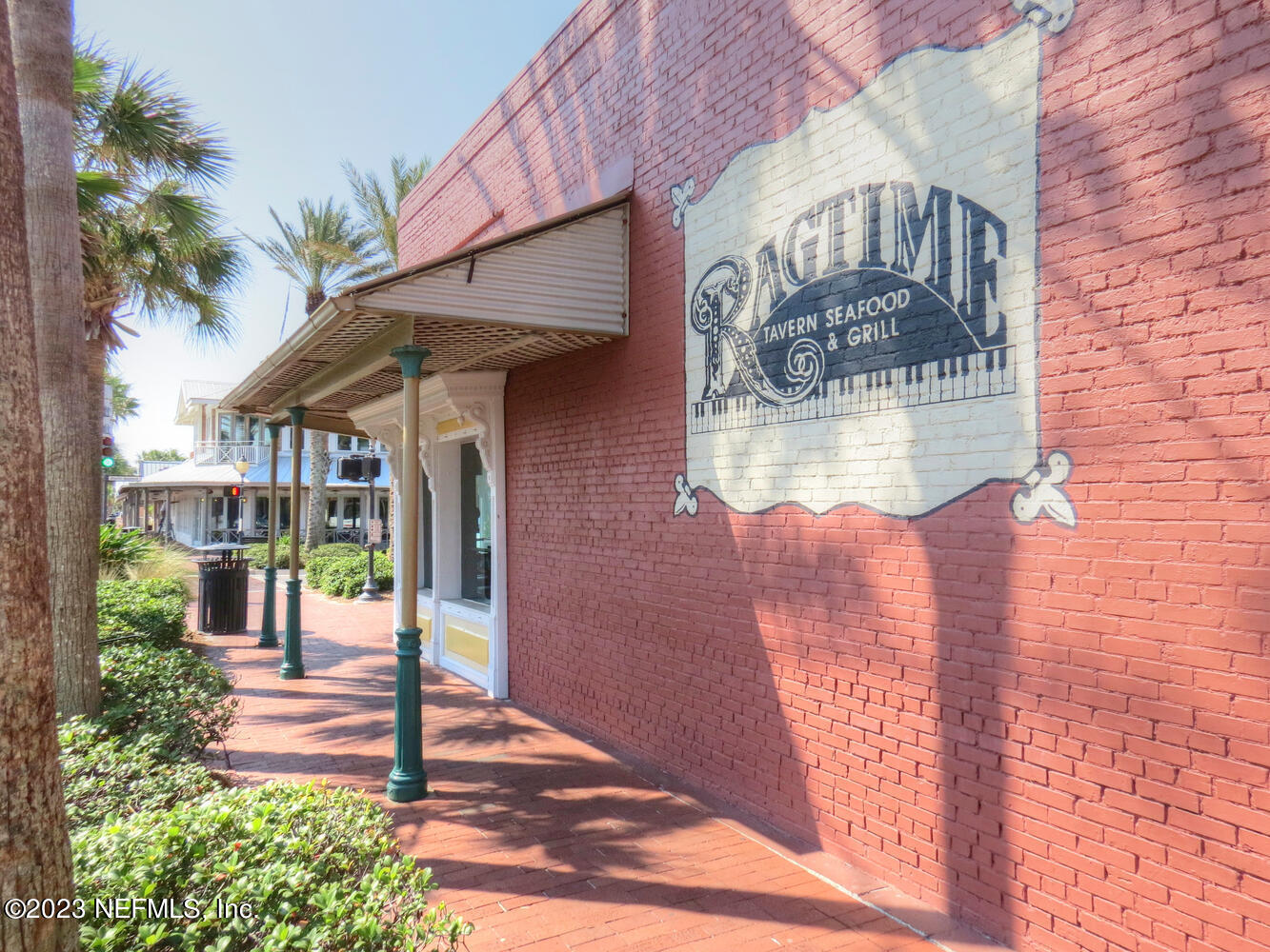 962 Ocean Boulevard Atlantic Beach, FL 32233 - Photo 60 of 63 a front view of a house with a glass door