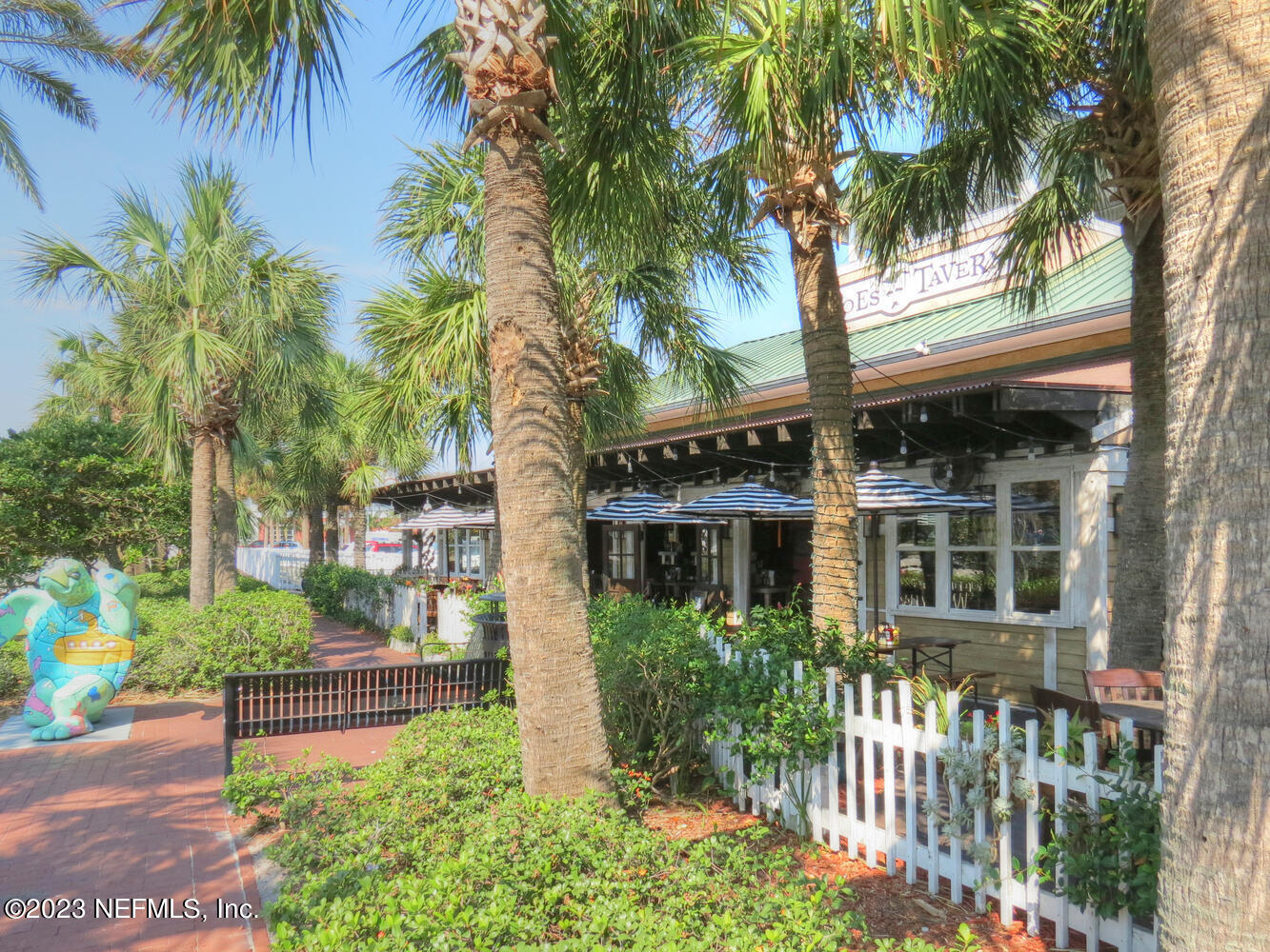 962 Ocean Boulevard Atlantic Beach, FL 32233 - Photo 61 of 63 a front view of a house with a garden