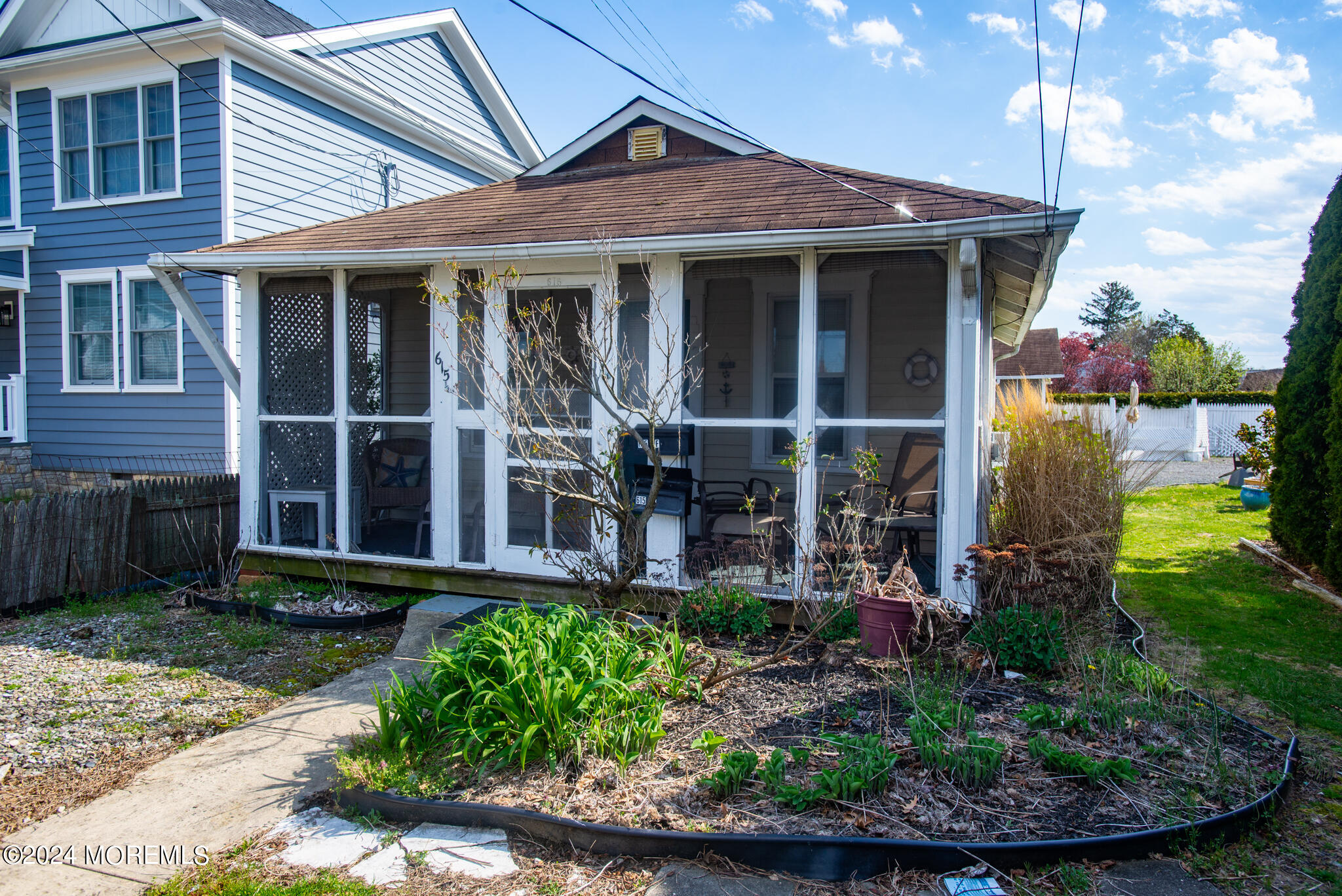 615 Ocean Road Spring Lake Heights, NJ 07762 - Photo 8 of 8 a view of a house with potted plants and a yard