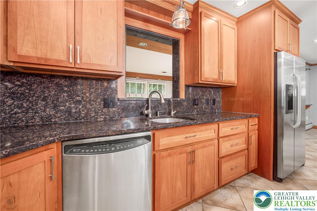 3517 Fish Hatchery Road Allentown, PA 18103 - Photo 11 of 41 a kitchen with stainless steel appliances granite countertop a refrigerator and a sink