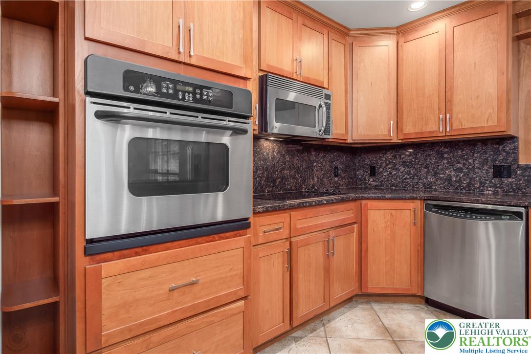 3517 Fish Hatchery Road Allentown, PA 18103 - Photo 12 of 41 a kitchen with stainless steel appliances granite countertop cabinets and a microwave oven