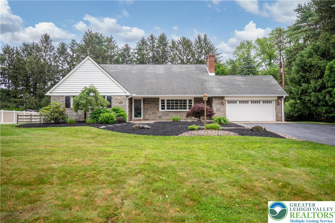 3517 Fish Hatchery Road Allentown, PA 18103 - Photo 2 of 41 a front view of house with yard and trees in the background
