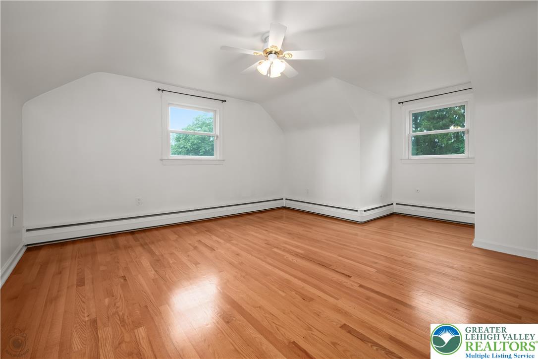 3517 Fish Hatchery Road Allentown, PA 18103 - Photo 26 of 41 an empty room with wooden floor and windows