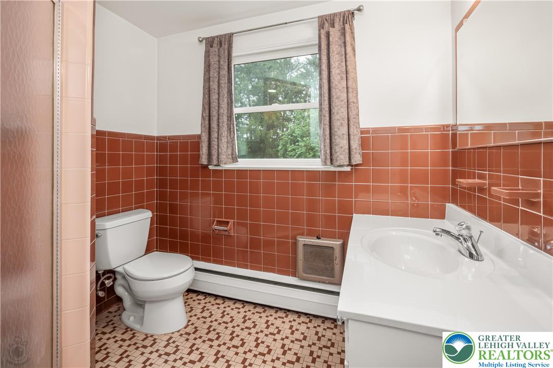 3517 Fish Hatchery Road Allentown, PA 18103 - Photo 27 of 41 a bathroom with a sink a toilet and a mirror
