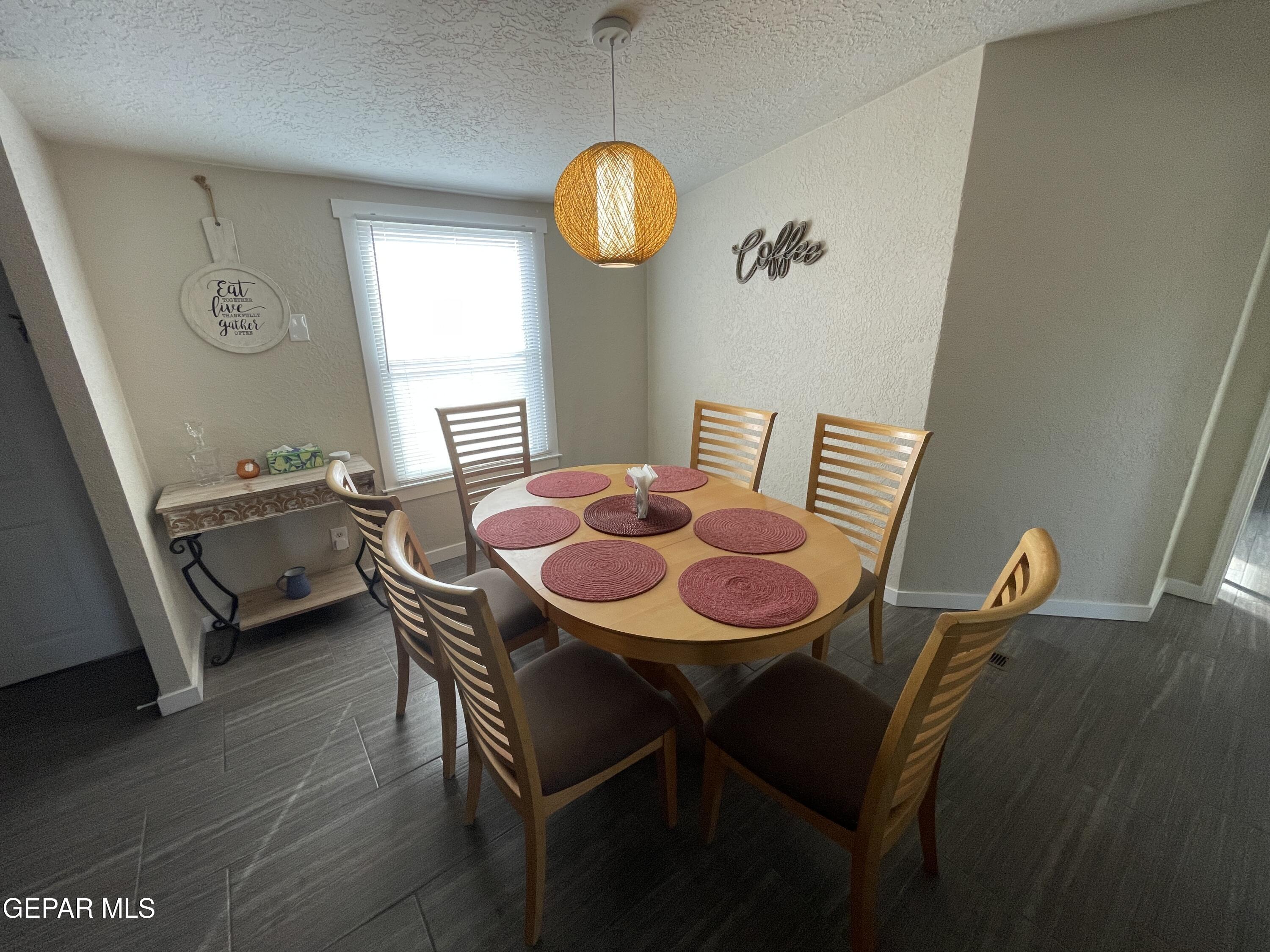 2901 Cook Street Truth Or Consequences, NM 87901 - Photo 7 of 28 a view of a dining room with furniture and window