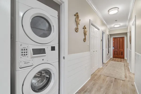 a view of a hallway with washer and dryer
