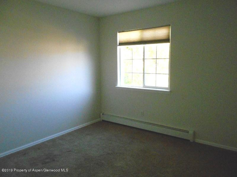 401 Evergreen Drive Rifle, CO 81650 - Photo 12 of 18 an empty room with a window
