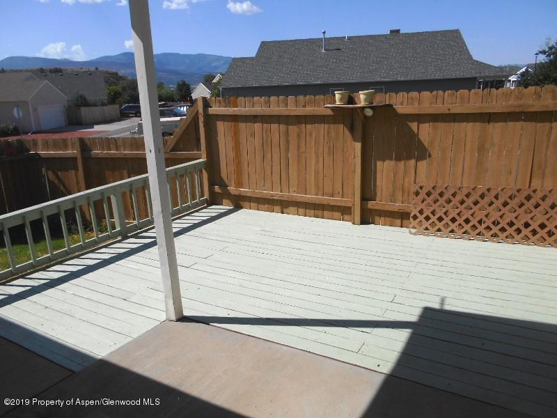 401 Evergreen Drive Rifle, CO 81650 - Photo 13 of 18 a backyard of a house with wooden fence