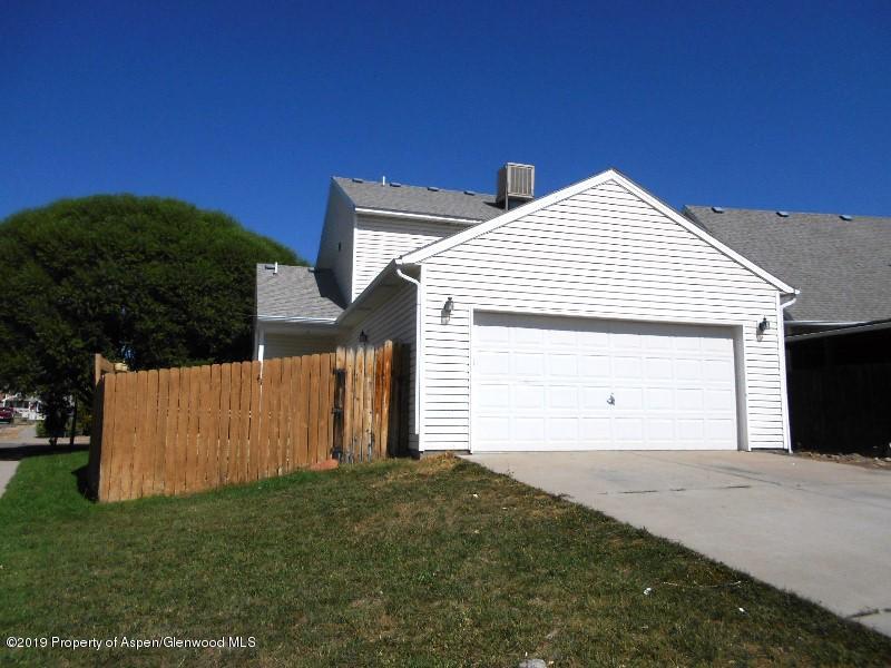 401 Evergreen Drive Rifle, CO 81650 - Photo 17 of 18 a view of a house with a yard