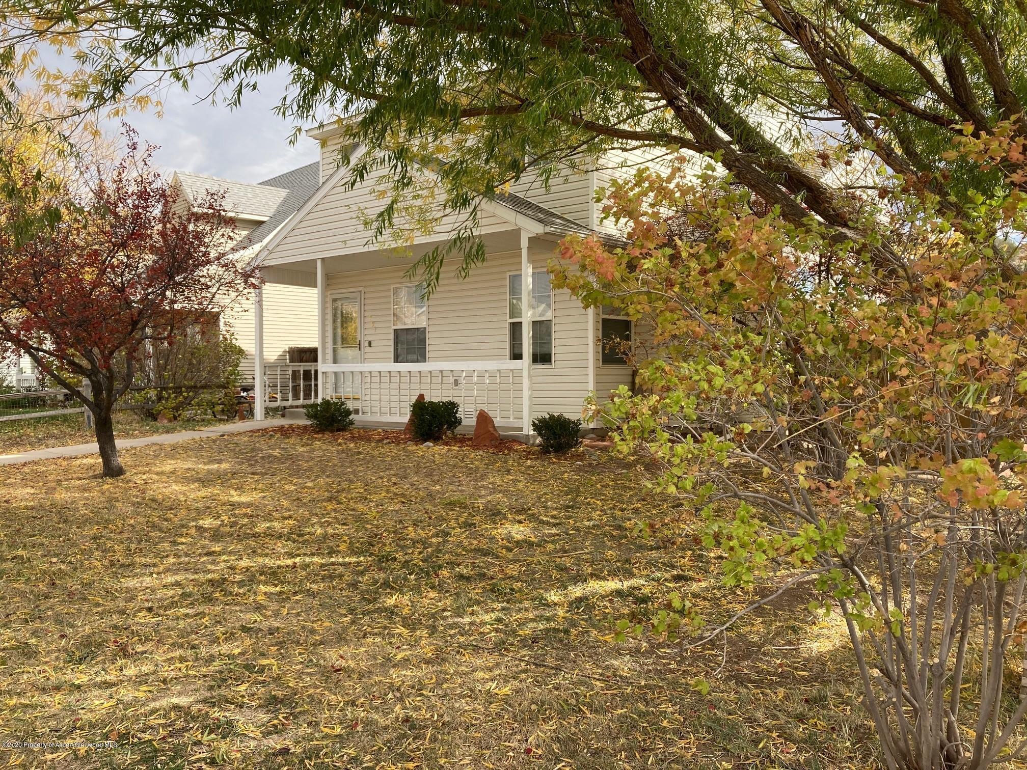 401 Evergreen Drive Rifle, CO 81650 - Photo 2 of 18 a view of a house with a tree