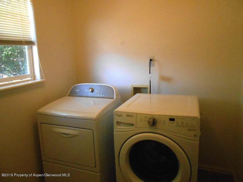 401 Evergreen Drive Rifle, CO 81650 - Photo 6 of 18 a utility room with dryer and washer