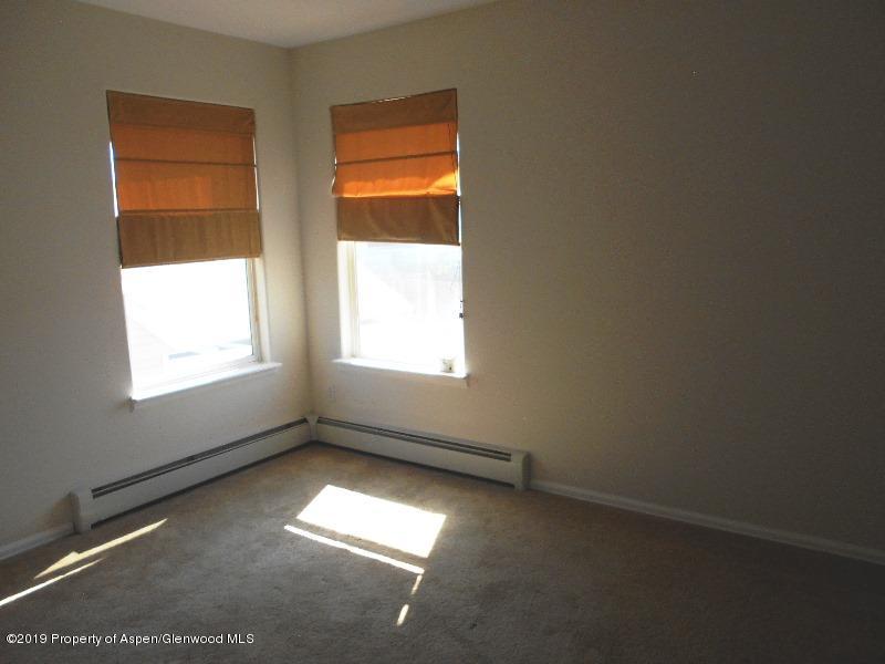 401 Evergreen Drive Rifle, CO 81650 - Photo 8 of 18 an empty room with a window