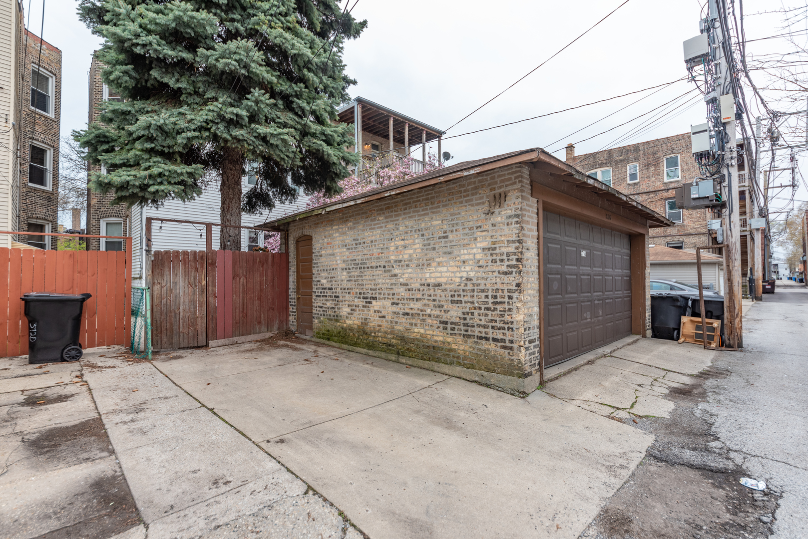 3716 North Racine Avenue, Unit 2 Chicago, IL 60613 - Photo 14 of 14 a front view of a house with a garage