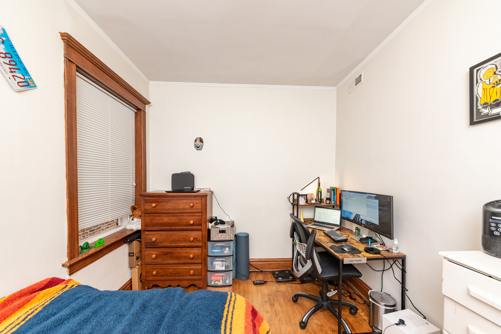 3716 North Racine Avenue, Unit 2 Chicago, IL 60613 - Photo 3 of 14 a view of a workspace with furniture and wooden floor