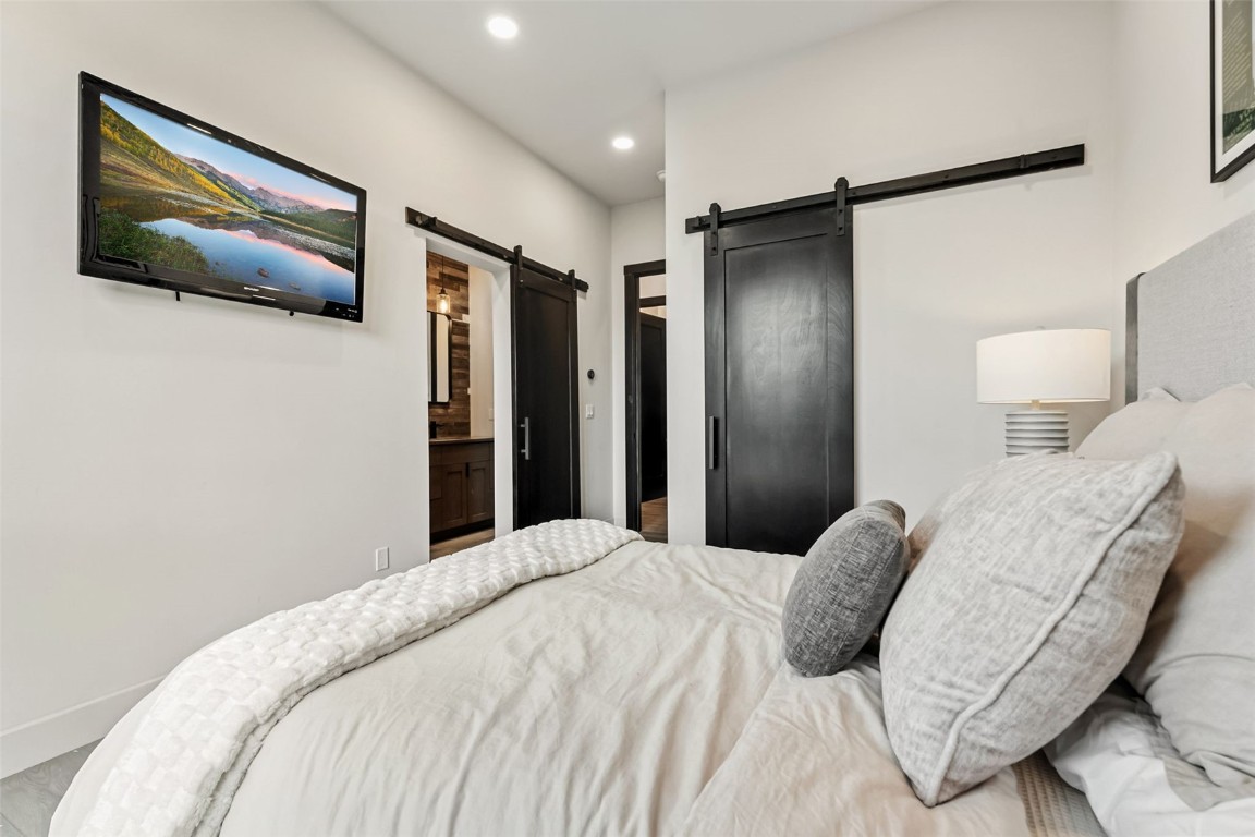 2520 Boreas Pass Road Breckenridge, CO 80424 - Photo 33 of 49 a bedroom with a bed and a painting on the wall