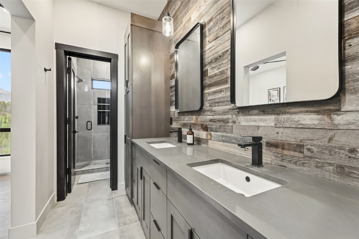 2520 Boreas Pass Road Breckenridge, CO 80424 - Photo 35 of 49 a bathroom with a double vanity sink mirror and bathtub
