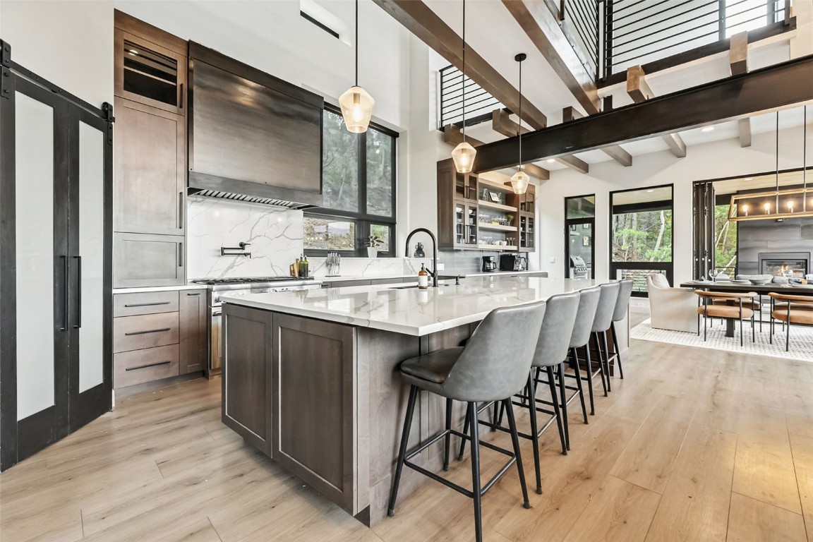 2520 Boreas Pass Road Breckenridge, CO 80424 - Photo 8 of 49 a kitchen with kitchen island granite countertop a sink cabinets and stainless steel appliances