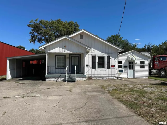 a front view of a house with a garage