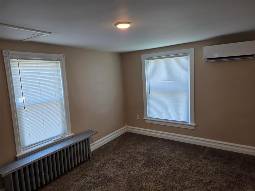 5166 Springmill Road Whitehall, PA 18052 - Photo 21 of 29 Well-lit room featuring soft carpeting and natural light from two windows.
