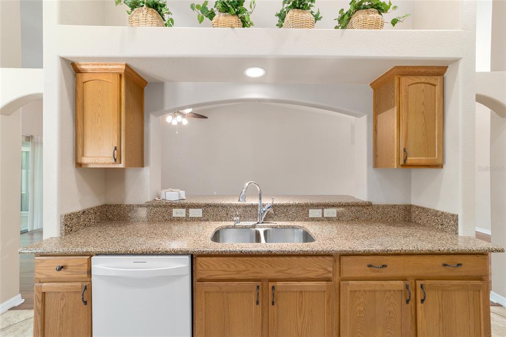16369 Southwest 14th Avenue Road Ocala, FL 34473 - Photo 17 of 49 a bathroom with a granite countertop sink a mirror and cabinets