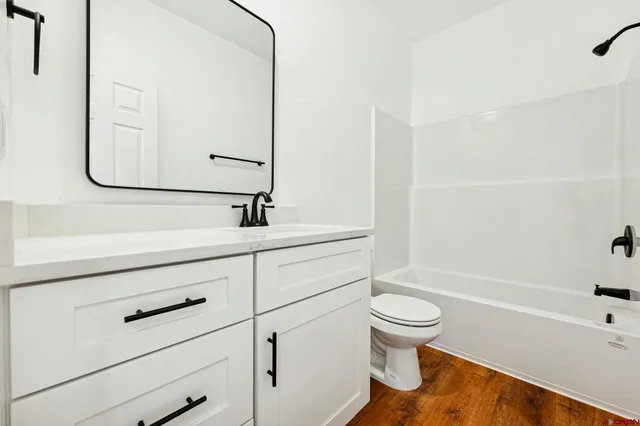 a bathroom with a sink a toilet and a bathtub