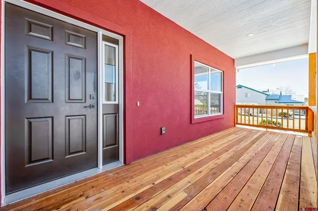 a view of a house with wooden floor and a balcony