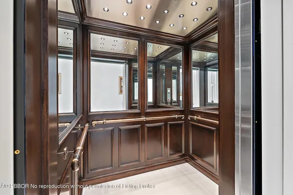 a living room with furniture a fireplace and a window