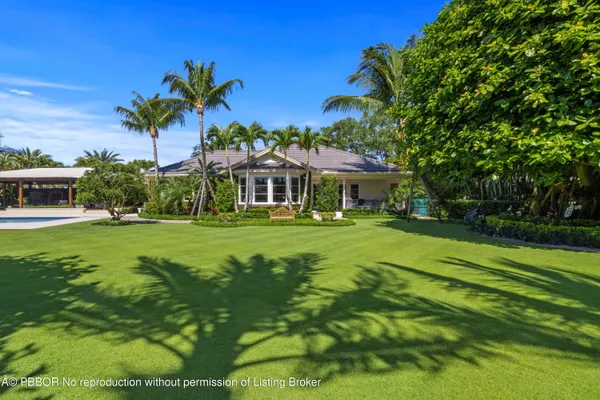 a front view of a house with a garage