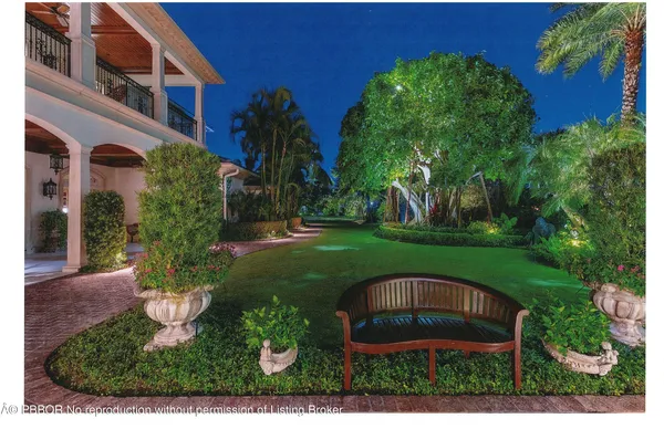 an aerial view of a house with a yard basket ball court and outdoor seating