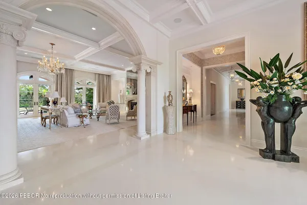 a view of a livingroom with furniture and a chandelier