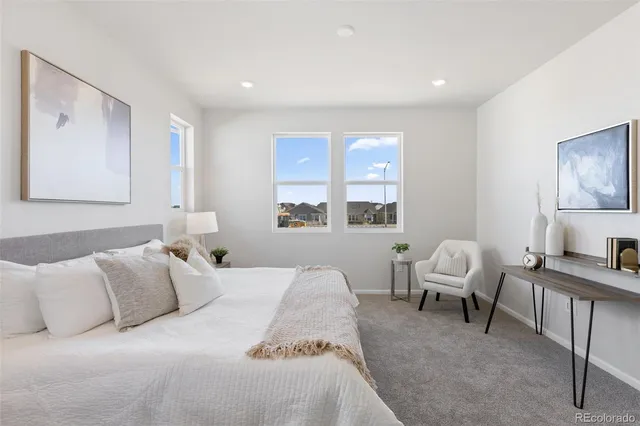 a bed room with a bed and a window