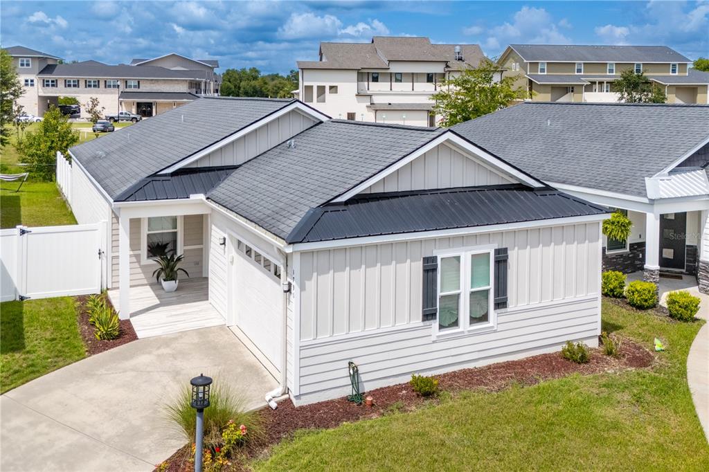 a aerial view of a house with a yard