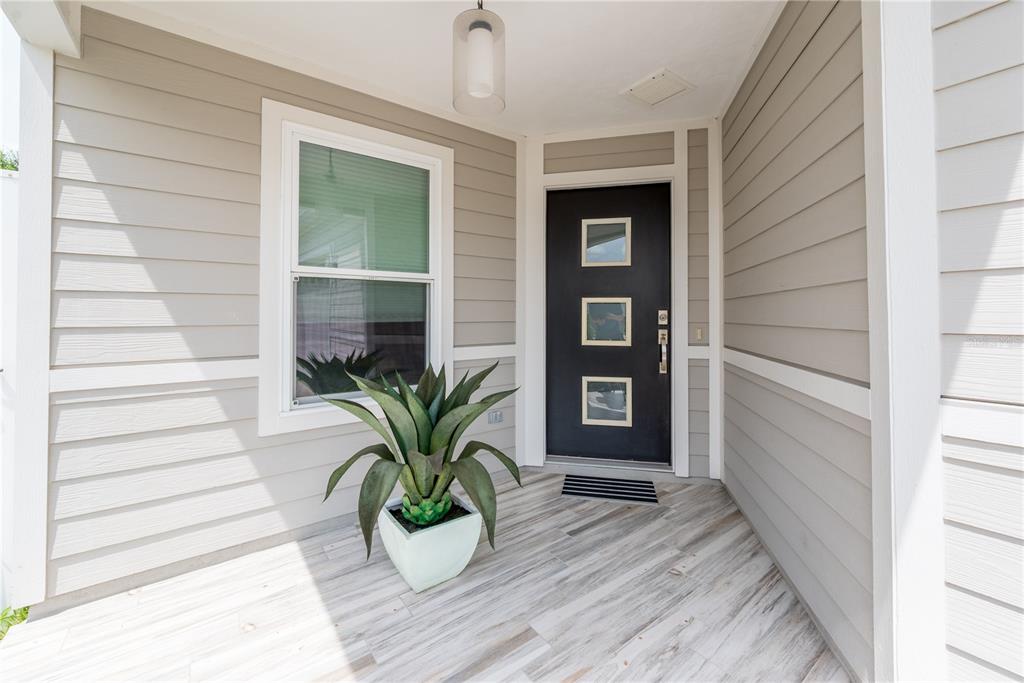 1790 Southwest 247th Street Newberry, FL 32669 - Photo 3 of 44 a view of front door and potted plant
