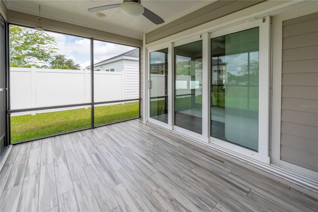 1790 Southwest 247th Street Newberry, FL 32669 - Photo 35 of 44 a view of an empty room with wooden floor and a window