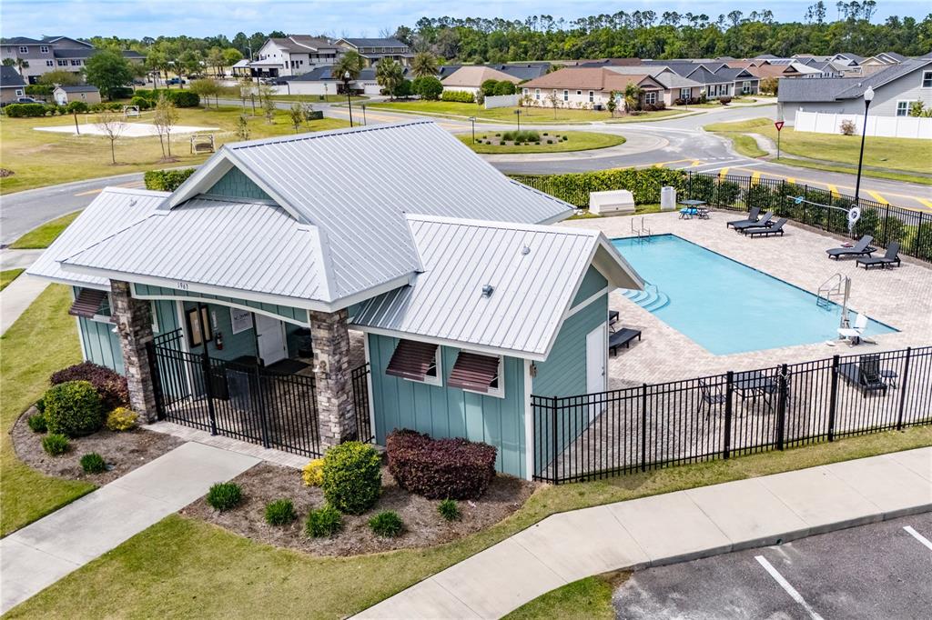 1790 Southwest 247th Street Newberry, FL 32669 - Photo 40 of 44 an aerial view of a house with swimming pool and ocean view