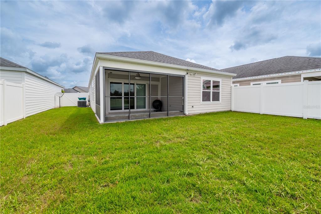 1790 Southwest 247th Street Newberry, FL 32669 - Photo 4 of 44 a view of a house with a garden