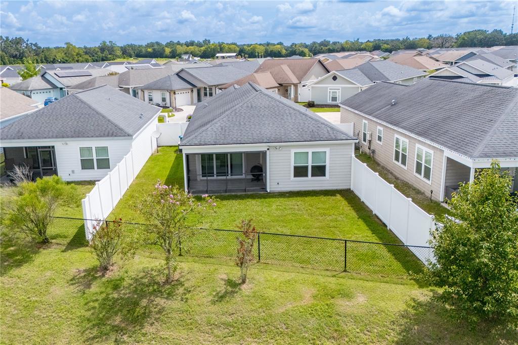 1790 Southwest 247th Street Newberry, FL 32669 - Photo 7 of 44 a aerial view of a house with swimming pool and a yard