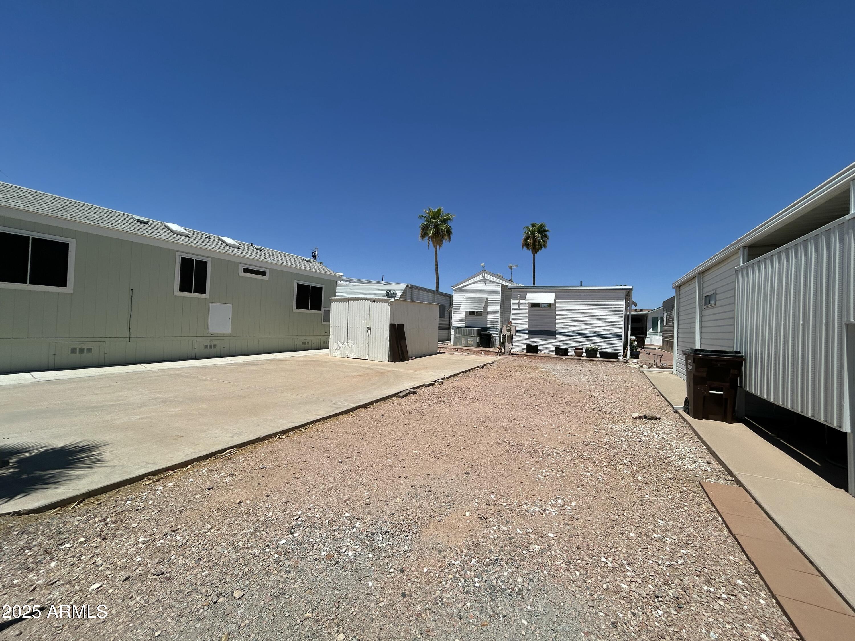 439 Ironstone Drive, Unit 439 Apache Junction, AZ 85119 - Photo 3 of 39 a view of a house with a street