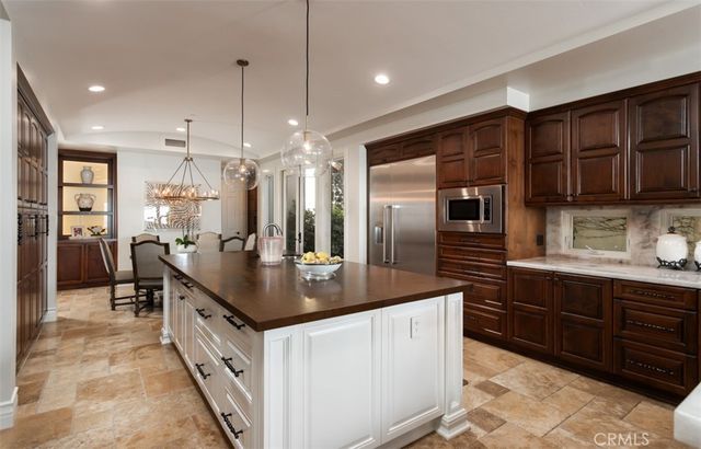 a dining room with furniture a window and kitchen view