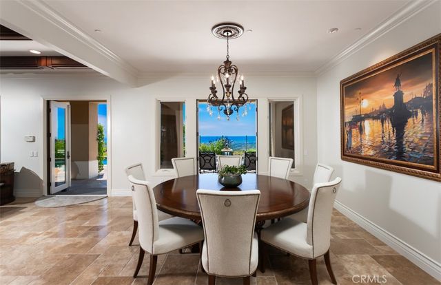 a view of a hallway with wooden floor and stairs
