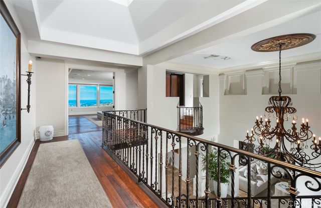 a living room with a large window and a bed