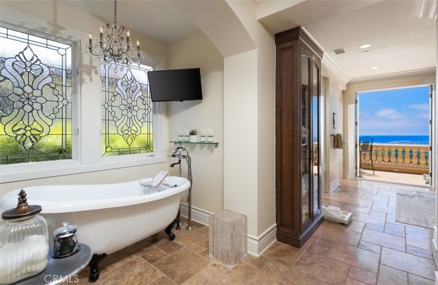 a living room with a flat screen tv and a large window